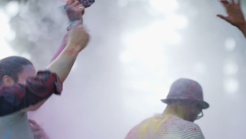 4K Happy hipster friends at music festival, dancing & throwing coloured powder. Shot on RED Epic. Royalty-Free Stock Footage #20370745