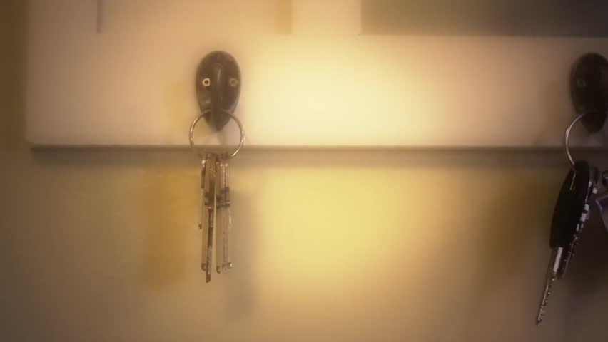 Keys hanging on a key rack (dolly shot)