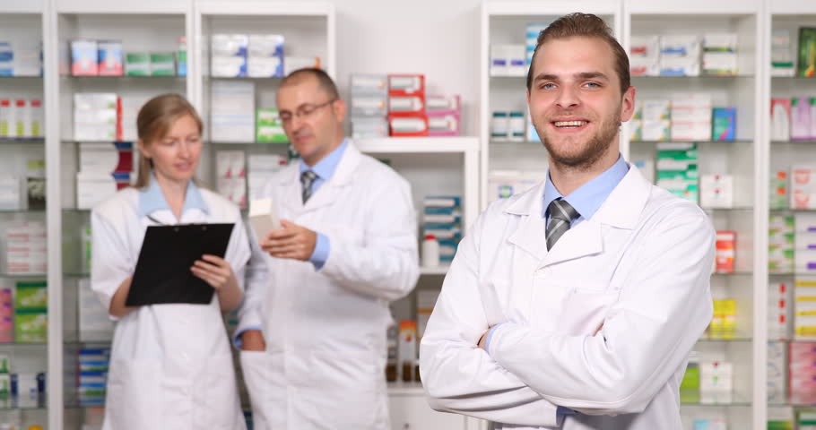 Staff activity. Famous people in Pharmacy Jacob Merck. Young man serving old man in Pharmacy.