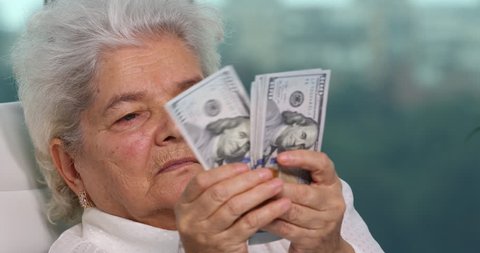 Elderly Woman Closeup Portrait Extreme Shot Count Us Dollars Bills Income Office. Ultra High Definition, UltraHD, Ultra HD, UHD, 4K, 2160P, 4096x2160