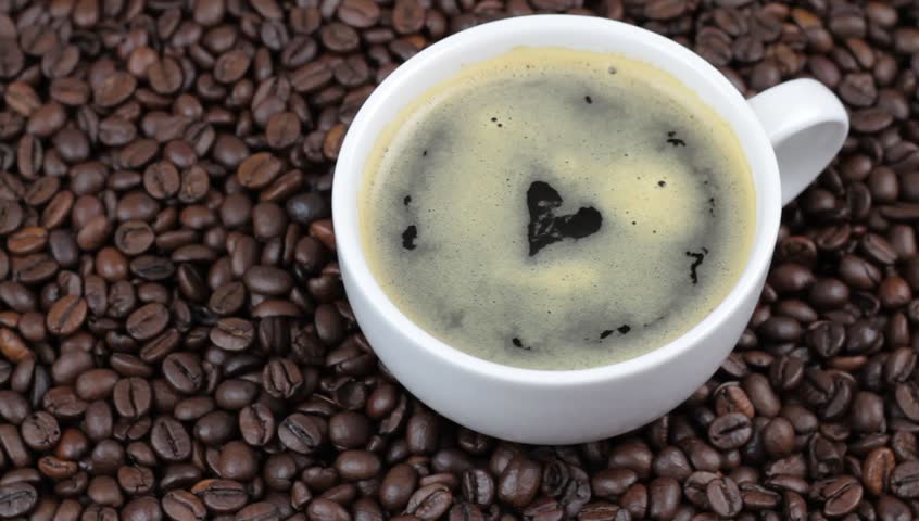 Coffee with heart shape on coffee beans