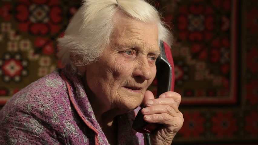 The Elderly Woman talking on the telephone With Rotary Dial Close Up Royalty-Free Stock Footage #20394571