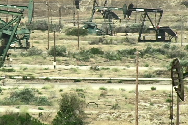 A zoom-out of an oil field. 