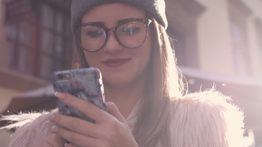 Smartphone girl using app on phone drinking coffee smiling in cafe. Beautiful multicultural young casual female professional on mobile phone. Royalty-Free Stock Footage #20403424