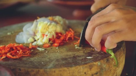 Close up of red pepper chopping on balinese kitchen