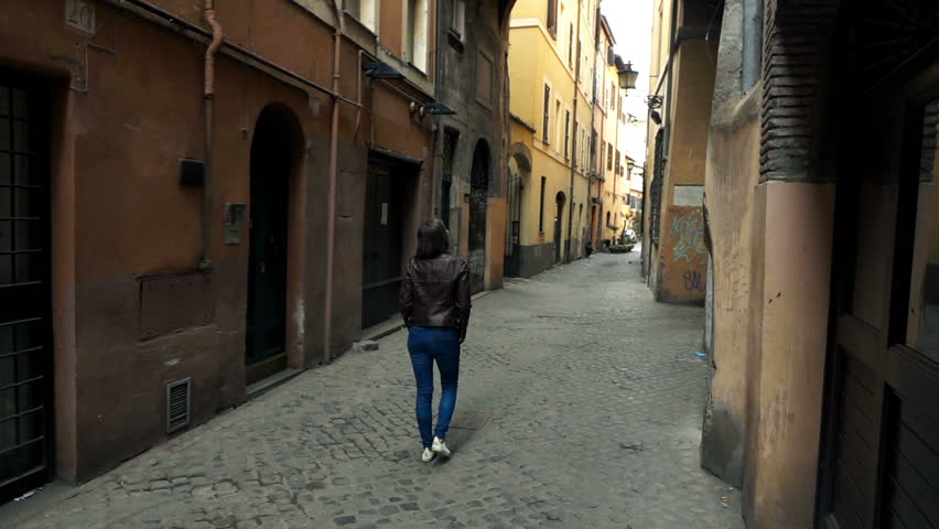 Woman walking through old town in Rome, Italy, super slow motion 240fps
