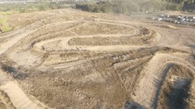 Flying over the mototrack. Flying over the motocross. Competition motorcycles from the air.