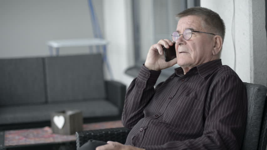Senior man calling with mobile phone
