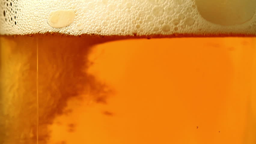 Beer is poured in a glass.
 | Shutterstock HD Video #2042516