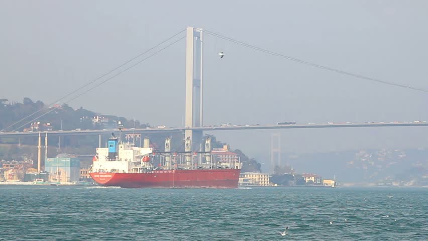 Bulk carrier ship sails in front of Ortakoy in Istanbul.