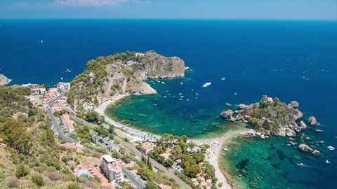 Isola Bella Wide Landscape at Taormina Italy on the Island of Sicily Featuring the Coastal Coves of the Popular Beaches during the Sunny Summer Vacation Season
