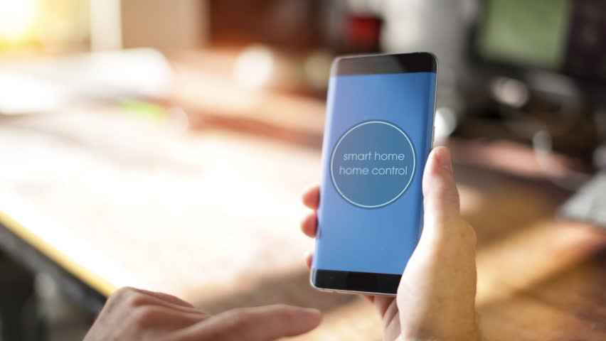 Smart Home - Man using smart home app on a smart phone. Smart home, intelligent house automation remote control concept. The Internet of things Royalty-Free Stock Footage #20433664