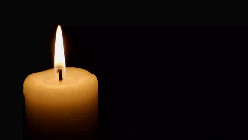 lit white candle over black background Stock Footage Video (100%