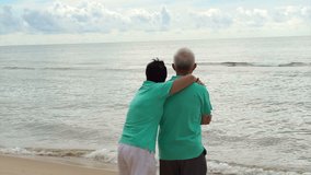 Asian senior couple walking happily by the beach. Well plan retired lifestyle no financial problem