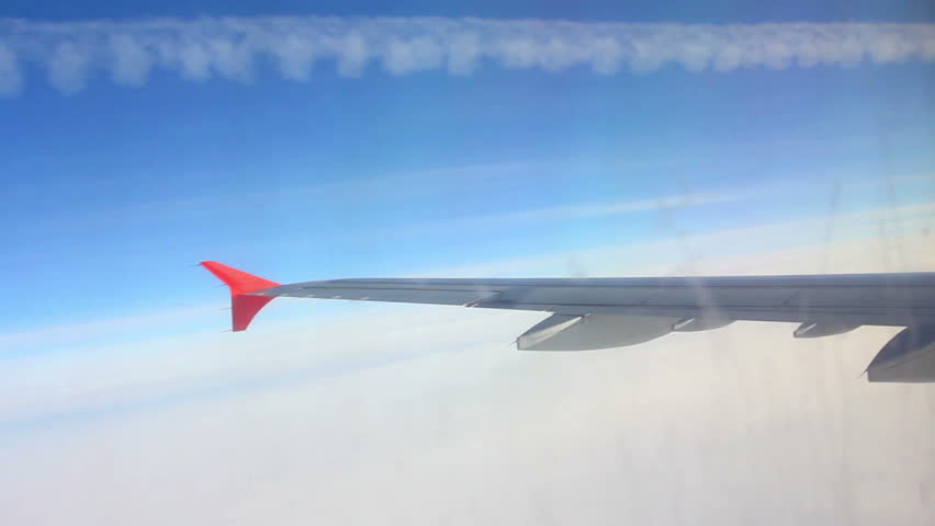 looking on wing and sky from airplane