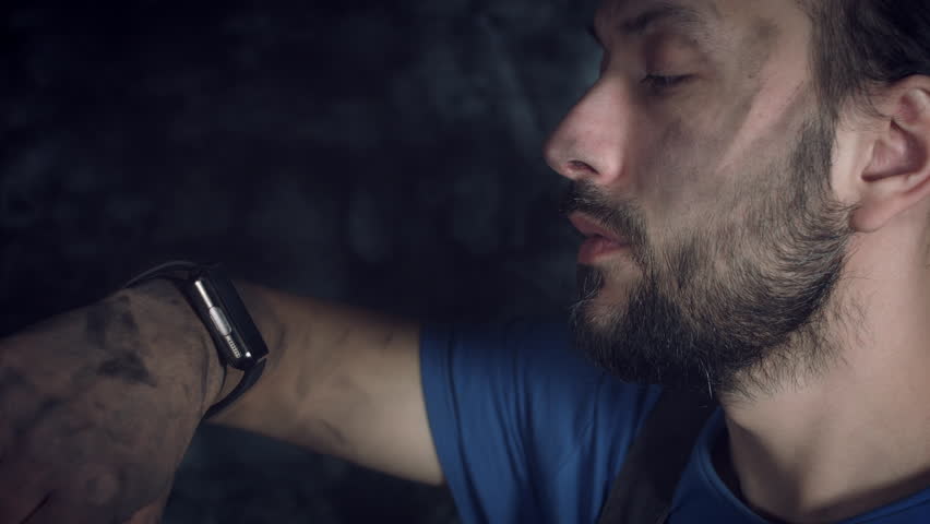 4K Hi-Tech Shot of a Mechanic Man Checking his Smartwatch
