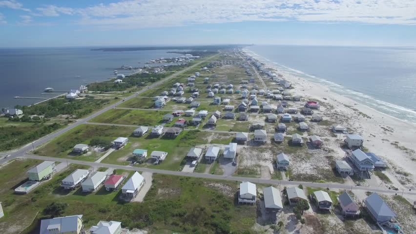 Drone/Aerial footage of the beaches and ocean of Gulf Shores/Fort Morgan Alabama, USA.  This white sand beach resides on the Gulf of Mexico