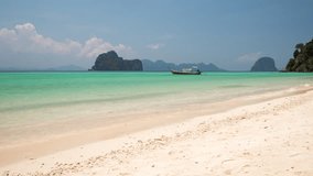 Beautiful sandy beach and ocean bay of tropical island Ko Ngai, Trang, Thailand. 4K timelapse video with panning up motion.