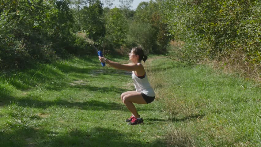 beautiful sporty woman exercising  in countryside