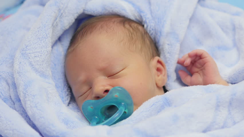 newborn sleeping with pacifier