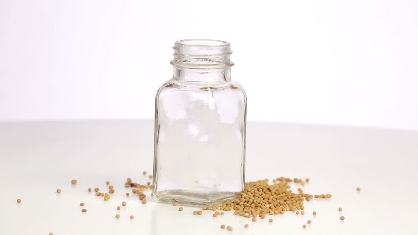 Mustard oil is poured into the bottle