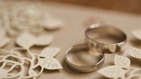 The wedding rings rotating with beatiful background