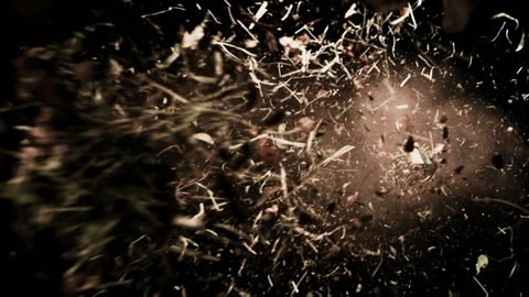 High quality motion animation representing various pieces of debris, falling in slow motion, on a black background.
