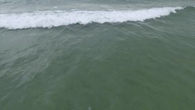Slow Motion Aerial Video of the Wild Sandy Beach With Clear Water, Waves and Foam, Vietnam