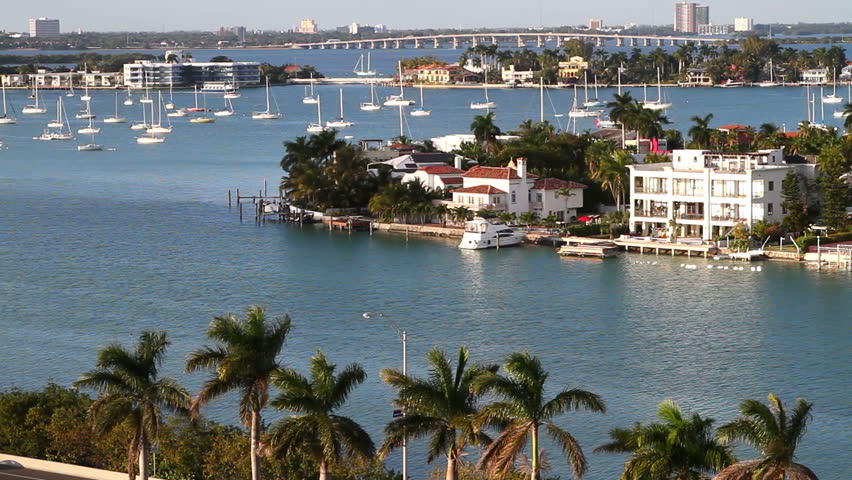 sailboats in miami bay area on a beautiful summer day, aerial view, near star