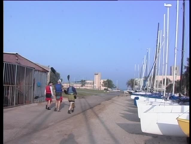 Walking to the sea with sculls