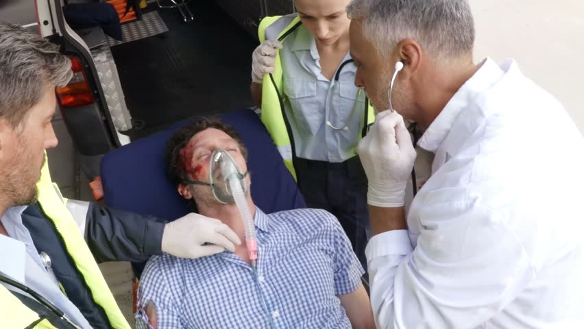 Paramedic using an external defibrillator during cardiopulmonary resuscitation in hospital | Shutterstock HD Video #20465887