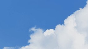 Cloudscape time-lapse 4k nature video: rolling cumulus clouds moving on blue sky sunny day 