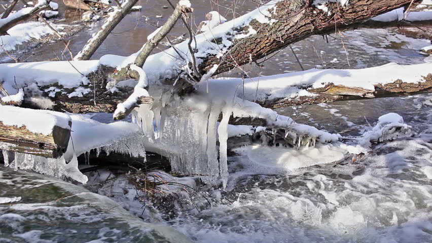 Stream in the form of small falls and the frozen icicles in the winter. 