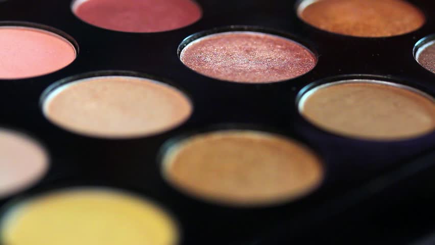 Close-up footage of a make up palette and a make up artist using a color from the palette... Royalty-Free Stock Footage #20530351
