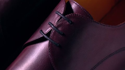 New brown leather bespoke mens boots. 4K macro pan shot, rack focus