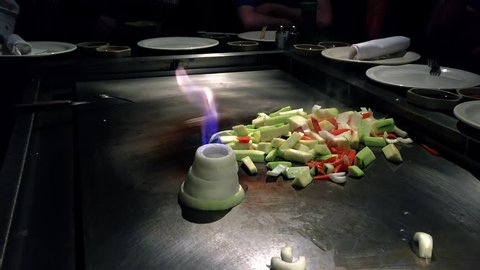 Japanese hibachi, creating an onion volcano in slow motion, 60fps