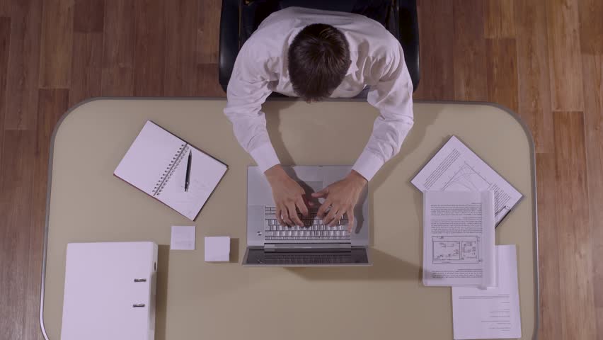Businessman in working process. High-angle shot Royalty-Free Stock Footage #20574652