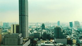 View of cityscape from glass elevator. Silom district, Bangkok, Thailand. Cinematic look video. Ultra HD