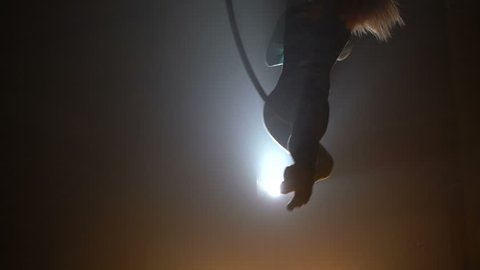 Aerial acrobat woman on circus stage. Silhouette Video Stok