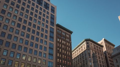 NEW YORK CITY - OCTOBER 07 (TIMELAPSE): Hyperlapse walk on 5th Ave of Manhattan buildings on blue sky background on October 07, 2016 in New York, USA.