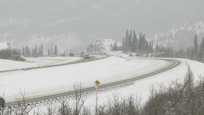 Cars traveling on snowy winter highway