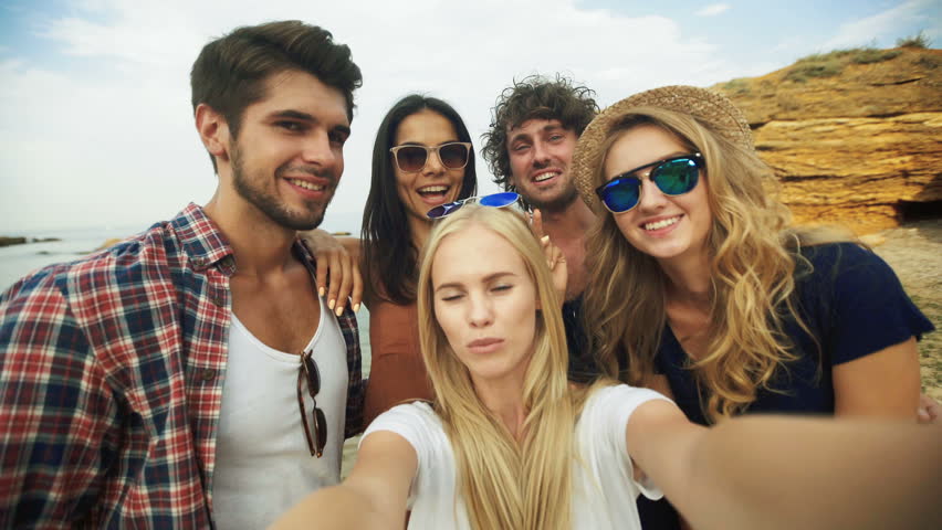 Shot of a group of friends taking a selfie on the beach Royalty-Free Stock Footage #20597137