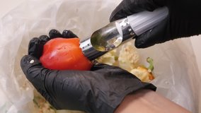 Separating the stem from paprika with kitchen tool 4K 2160p 30fps UltraHD footage - Winter stores preparation from bell peppers food background 3840X2160 UHD video