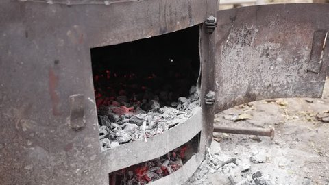 Slow motion Serbian rakija boiler fire in distilled process procedure 1080p FullHD footage - Tree logs in metal tube burning as part of making alcoholic hard liquor beverage slow-mo 1920X1080 HD video