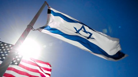 Israel and USA flags fluttering in the wind
