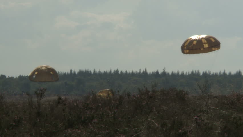 Military parachute drop and landing