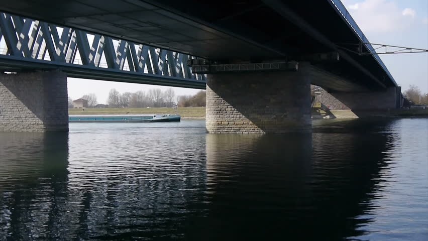 Freighter under bridge on Rhine