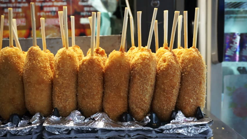 Korean battered fired hot dog, French fry encrusted corn dog Royalty-Free Stock Footage #20615308
