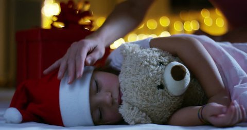 happy little girl, at Christmas, in the new year festivities asleep wait a gift for the Christmas holiday.
christmas  in family and children happy and tradition for the Christmas holiday and New Year. Stock Video