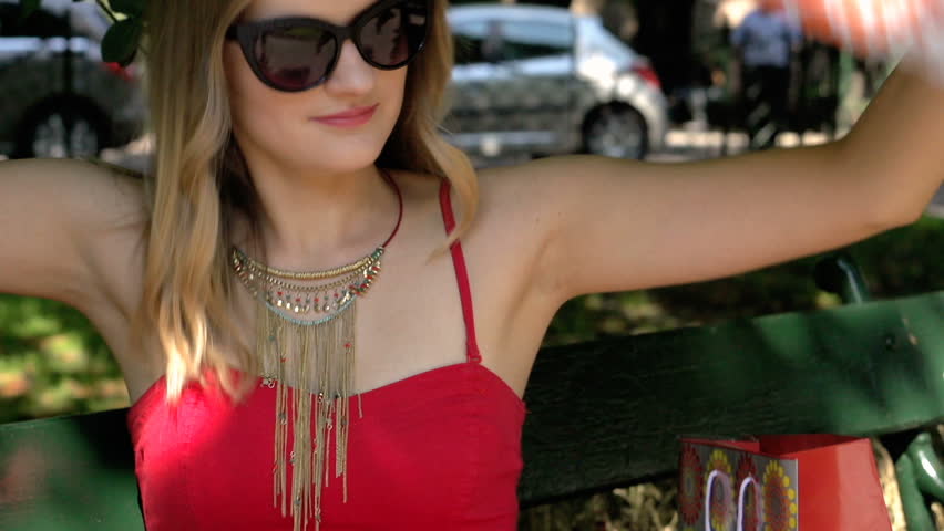 Stylish girl trying her new, colorful scarf, steadycam shot
